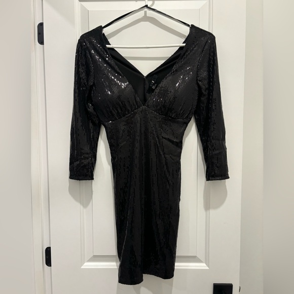 Forever 21 Dresses & Skirts - Black sequence mini dress with 3/4 length sleeves.